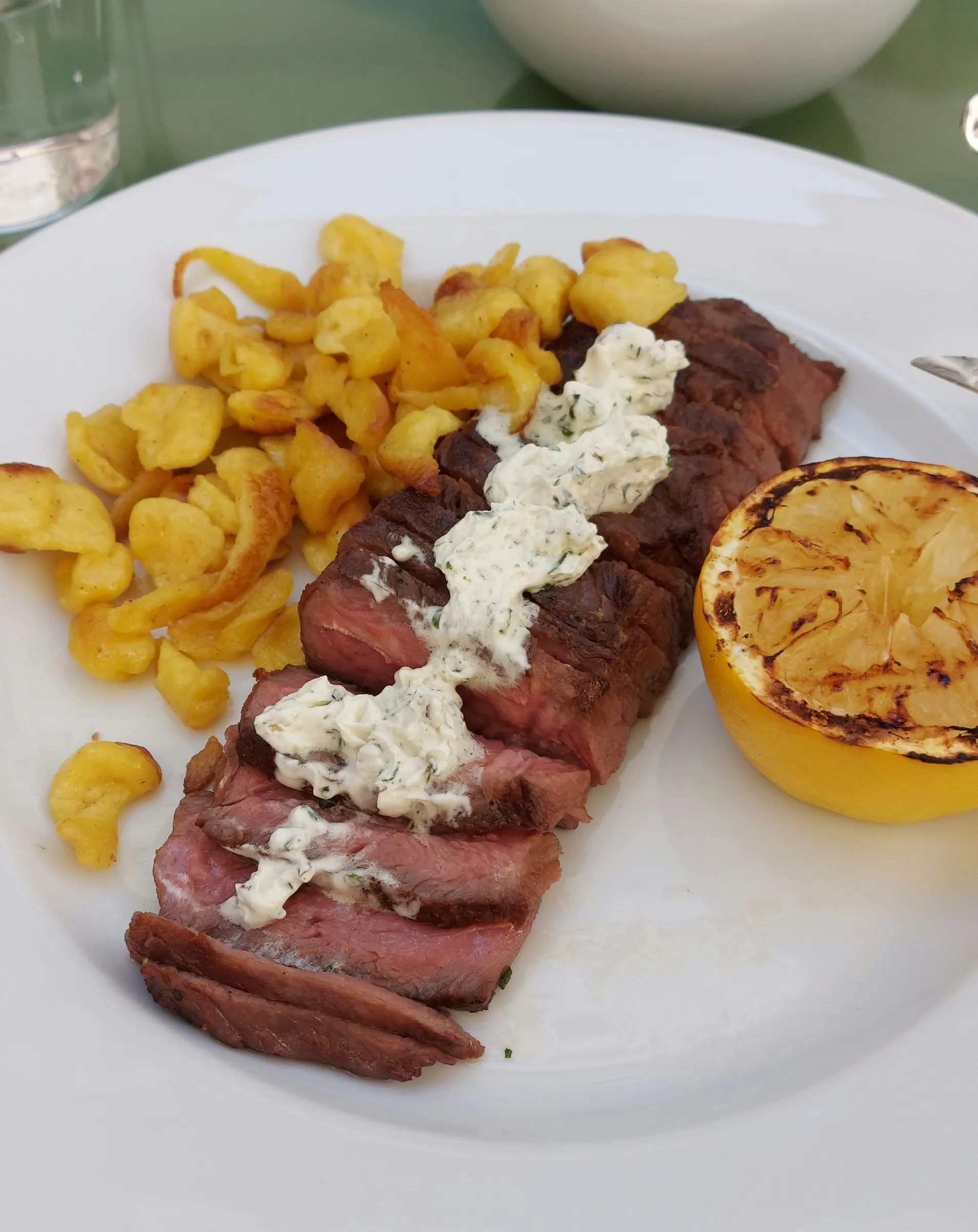 Flank steak with herb butter and Spätzli at Brasserie Kaiser