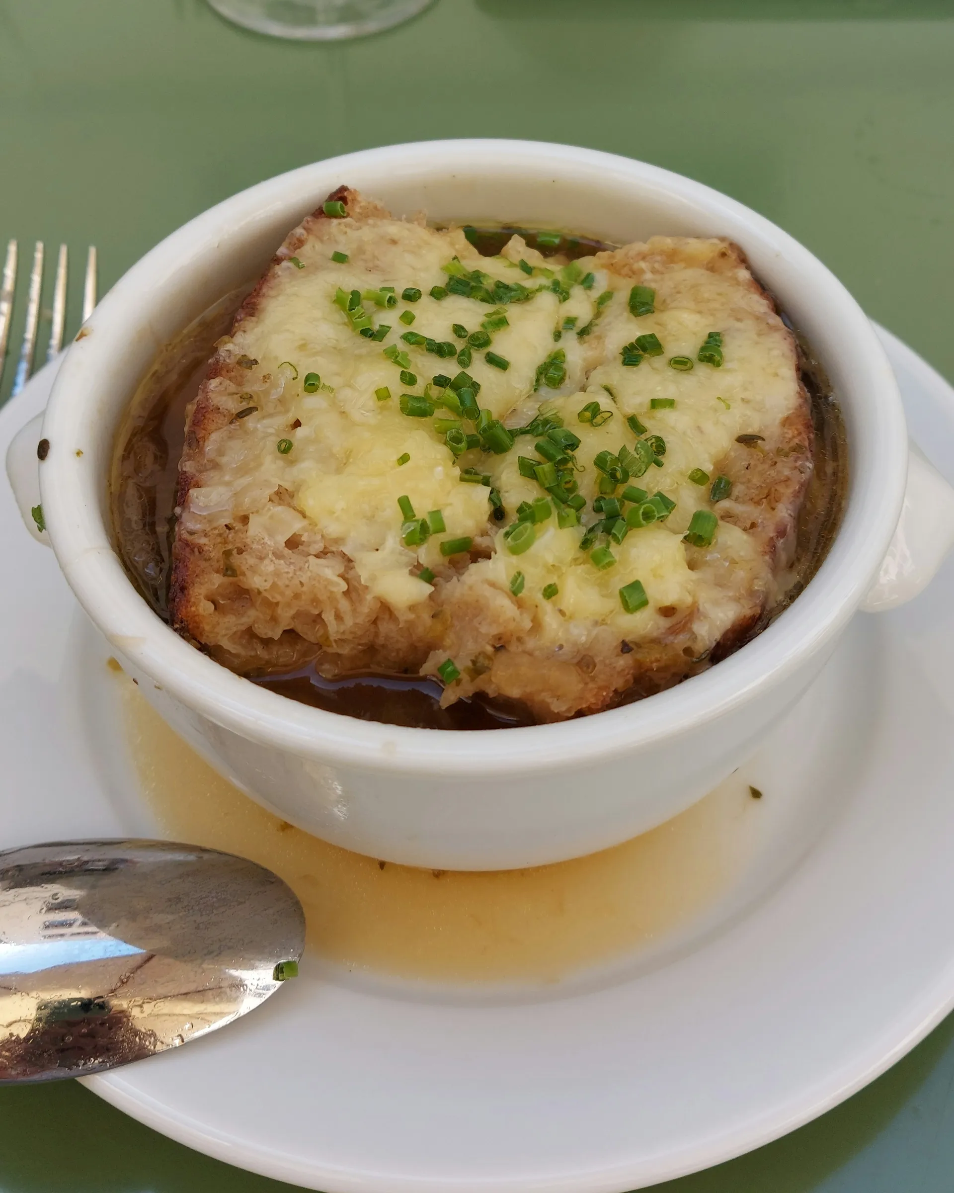 Gratinée onion soup at Brasserie Kaiser – bread slice topped with cheese