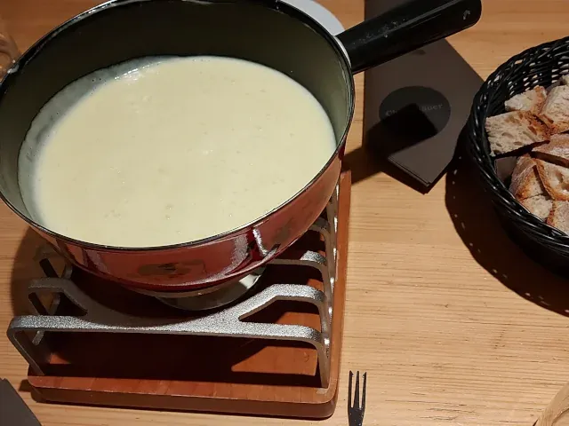 Fondue at ChäsChäuer Bern – melted cheese in a traditional ceramic pot