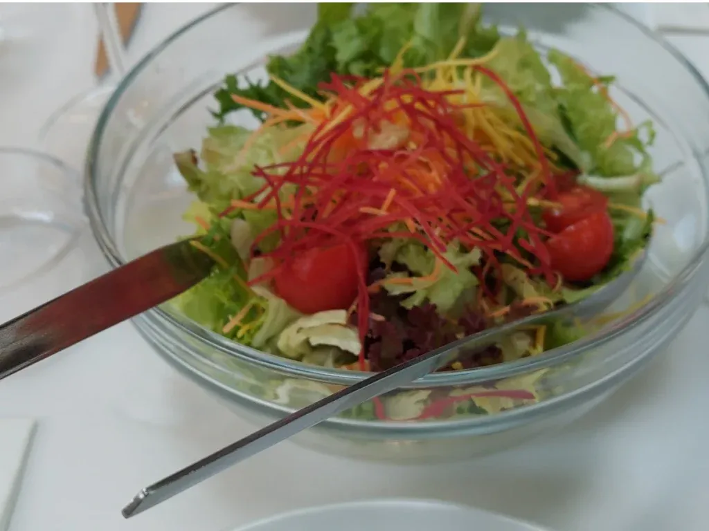 Salad bowl at Federal Bern with fresh salad and French dressing