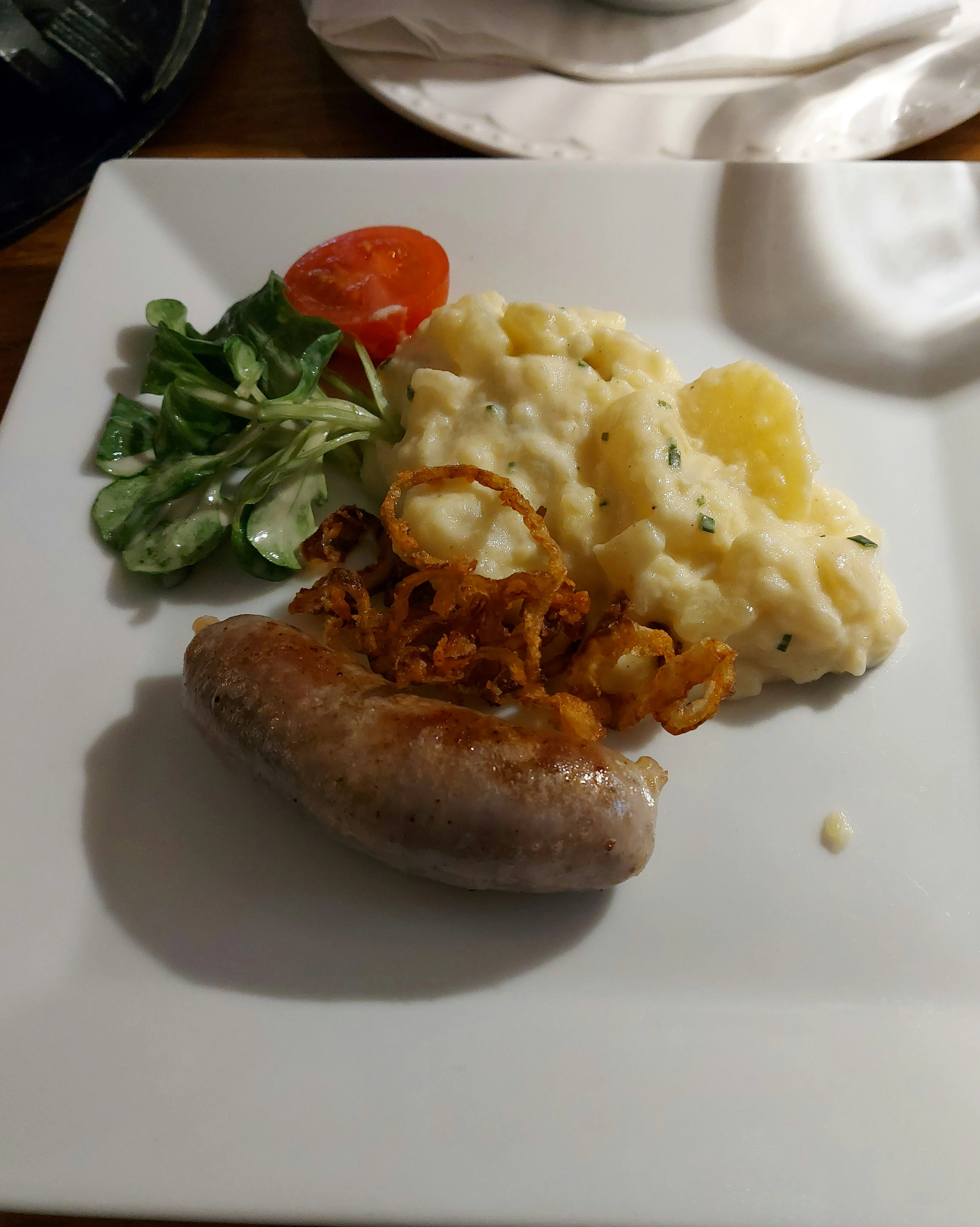 Bratwurst with potato salad at Harmonie Bern