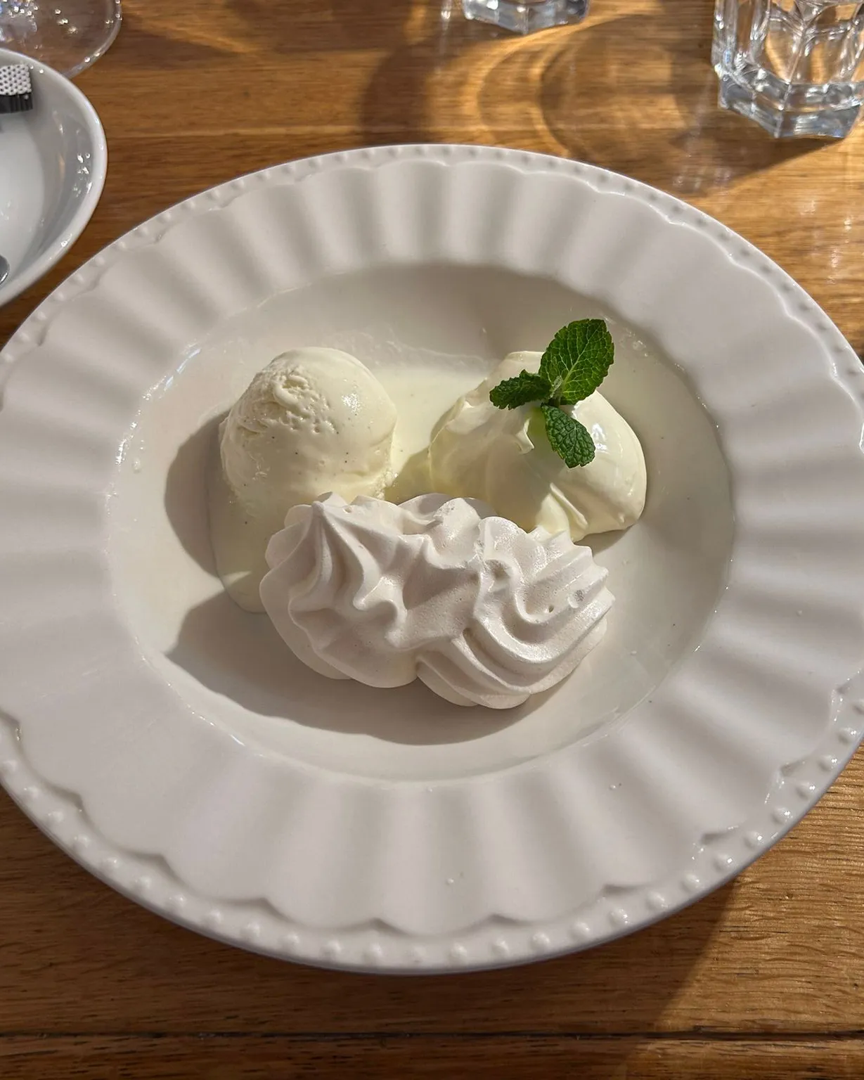Meringue with double cream and vanilla ice cream at Harmonie Bern