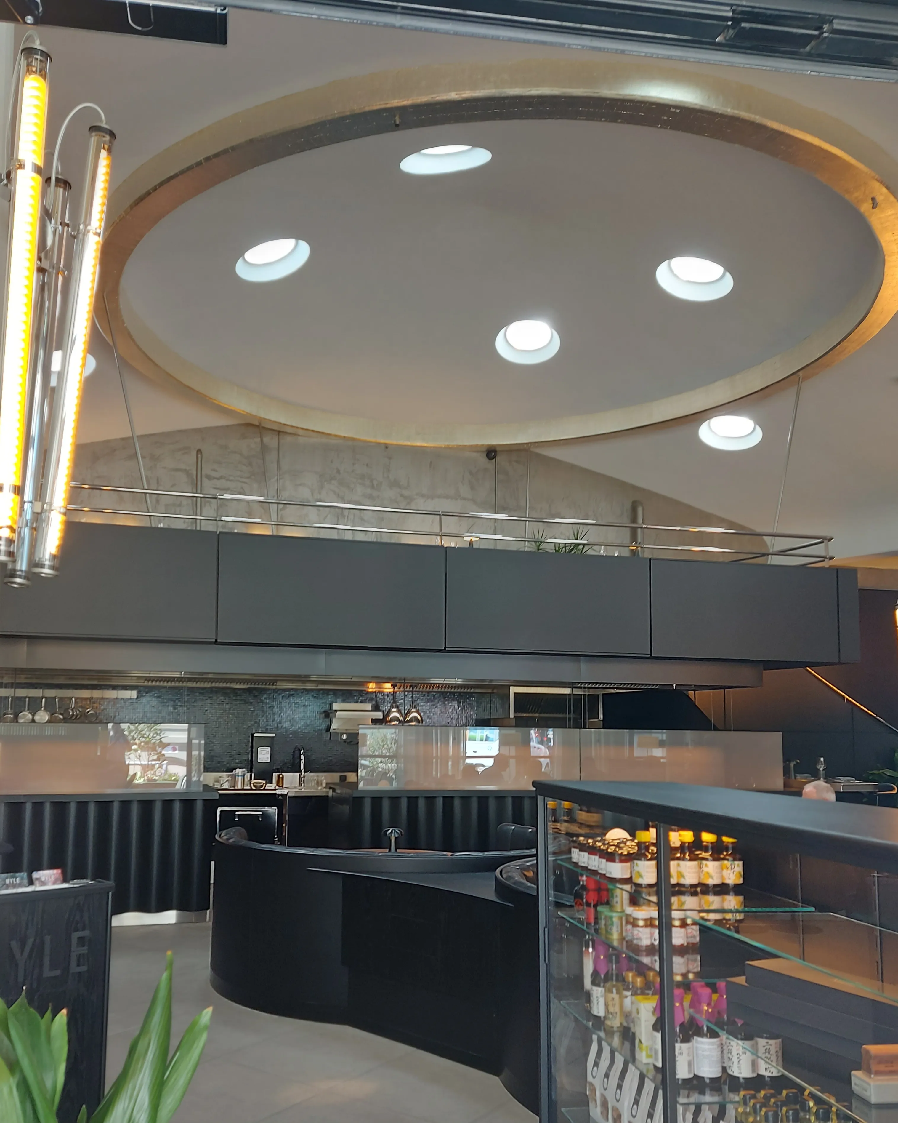 Myle Bern – interior with elegant lamps and black leather benches