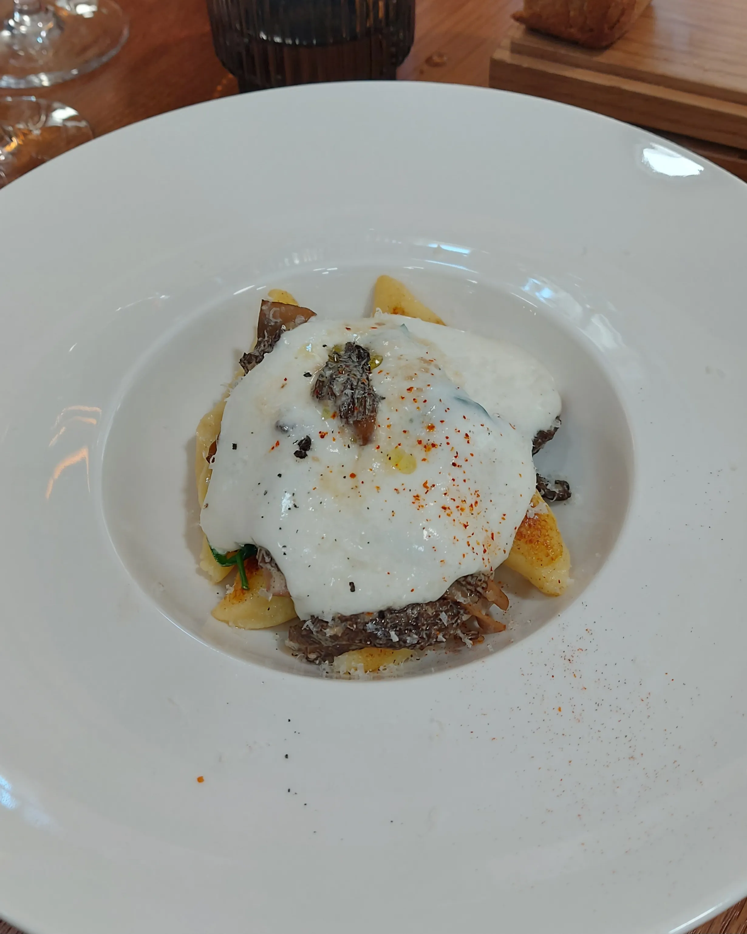 Myle Bern – potato gnocchi with spinach, fresh morels, and Taleggio foam