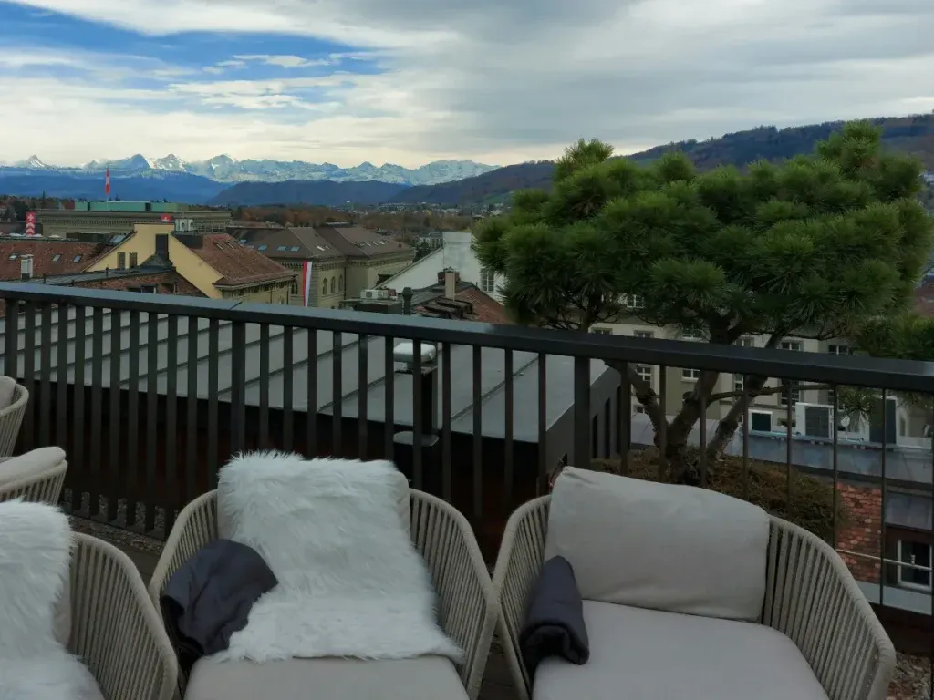 Terrace of Nido Bern with panoramic view of the Bernese Alps